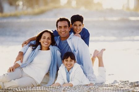 Family at beach on blanket